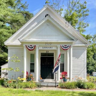 Bright summery day shows front of Holland Library